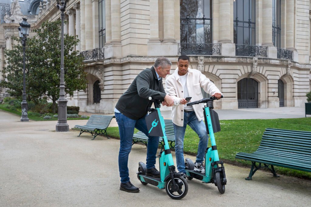 adults learning use electric scooter