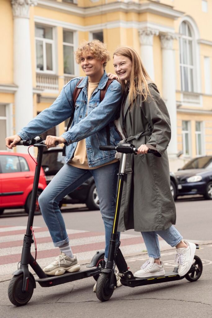 couple posing together outdoors electric scooters